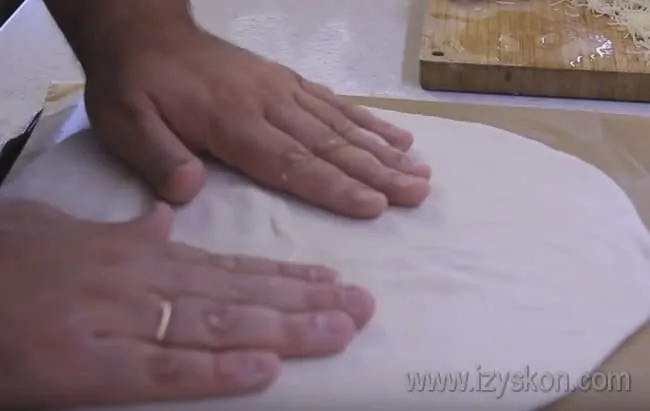 Carefully transfer the rolled out dough onto a baking sheet lined with parchment.