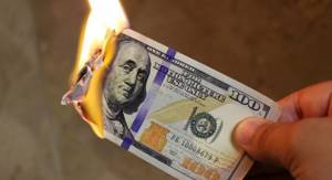 Banknote burns with flame