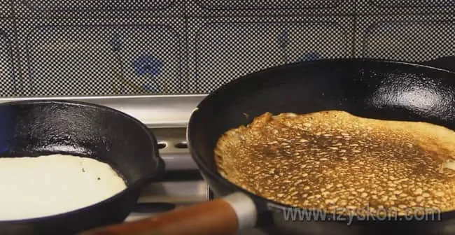 To fry pancakes faster, you can do this in two pans at once.
