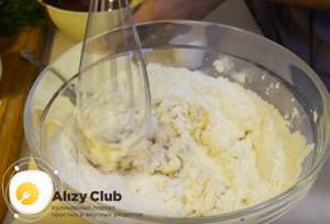 Add flour and mix the dough with a whisk.