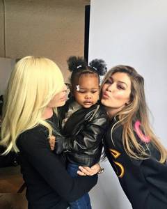 Gigi Hadid with her “daughter” and designer of the brand, Donatella Versace, on the backstage of the shoot
