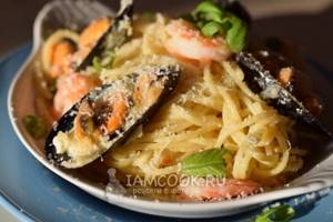 Photo of seafood pasta in creamy sauce