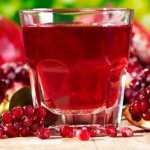 Pomegranate juice in a glass and pomegranate