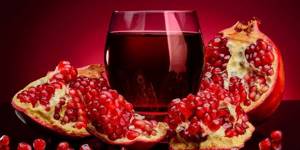 Pomegranates and juice in a glass