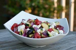 Greek salad with oregano, dill and mint photo