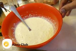Add grated cheese to the egg-milk mixture and mix.
