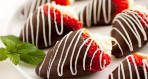Strawberries with cream and chocolate are delicious