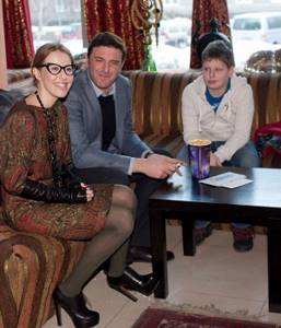Ksenia Sobchak and Maxim Vitorgan with his son