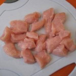Chicken fillet with garlic and mayonnaise in a frying pan. Chicken breast in mayonnaise (pieces) 