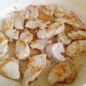 Chicken fillet in mayonnaise with garlic in a frying pan. Chicken breast in mayonnaise-garlic sauce 