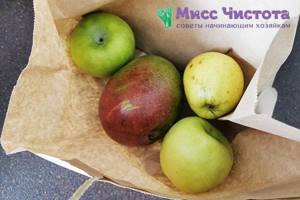 Mango in a paper bag with apples
