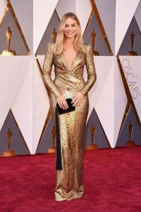 Margot Robbie in a gold dress at the Oscars