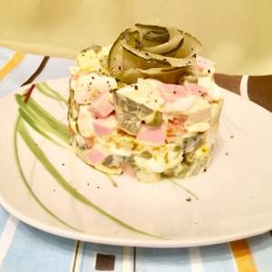 Portioned Olivier salad with boiled sausage - recipe with photo