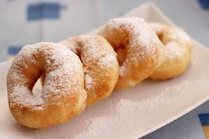sprinkle donuts with powdered sugar