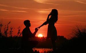 Romantic proposal at sunset