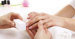 polishing nails before wet manicure