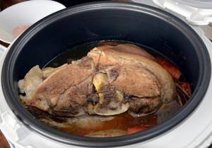 How long will it take to cook light pork in a slow cooker?