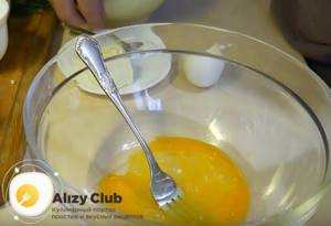 Lightly beat the egg with a fork.