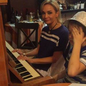 Tatyana Bulanova teaches her son music