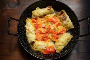stew cabbage rolls in a frying pan