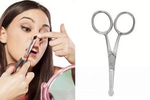 Removing nose hair with scissors