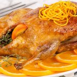 Duck with oranges, cooked in the oven