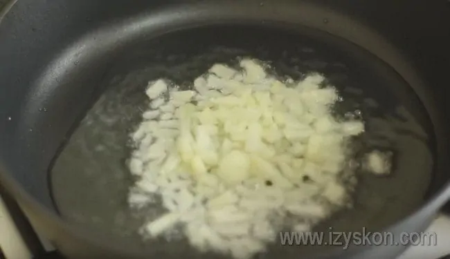 Place chopped onion in a frying pan.
